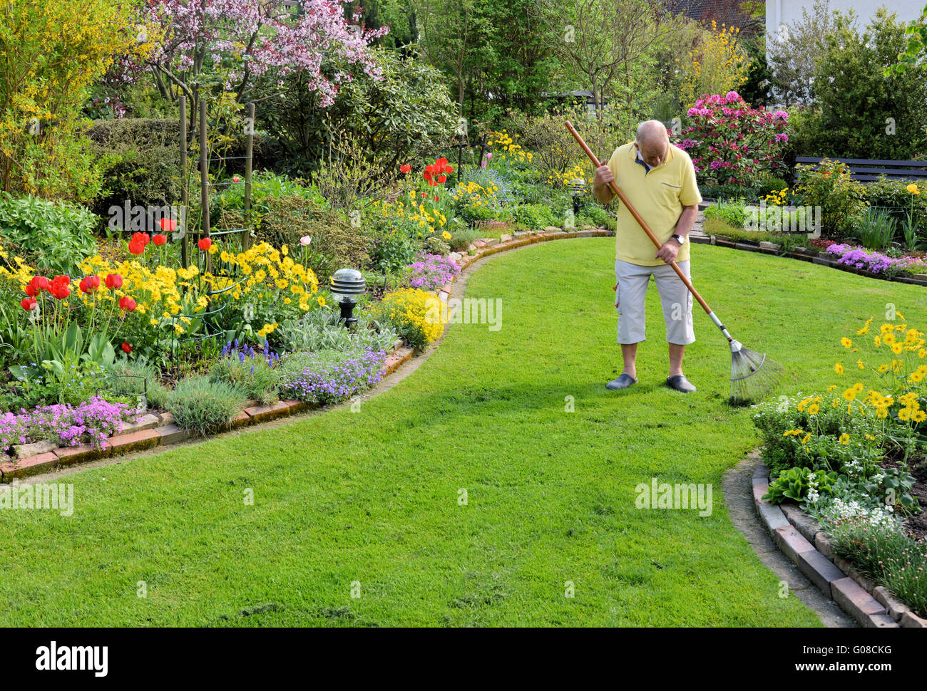 Seniors working in the garden Stock Photo - Alamy