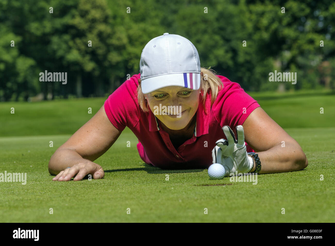 Golfer flips the golf ball with your fingers in th Stock Photo