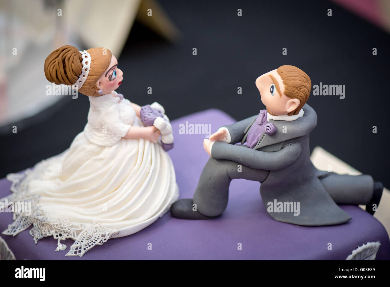 Bride Groom wedding proposal married couple at Cake International – The Sugarcraft, Cake Decorating and Baking Show in London Stock Photo