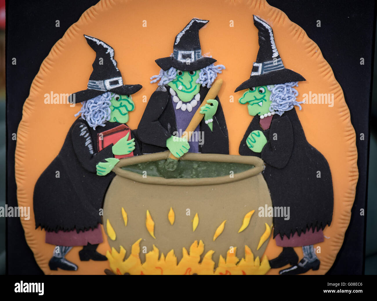 Halloween witches magic potion cauldron decor at Cake International – The Sugarcraft, Cake Decorating and Baking Show in London Stock Photo