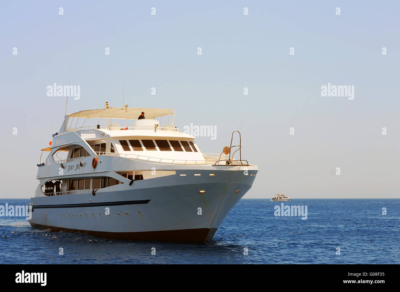 White ship moving by the red sea Stock Photo - Alamy