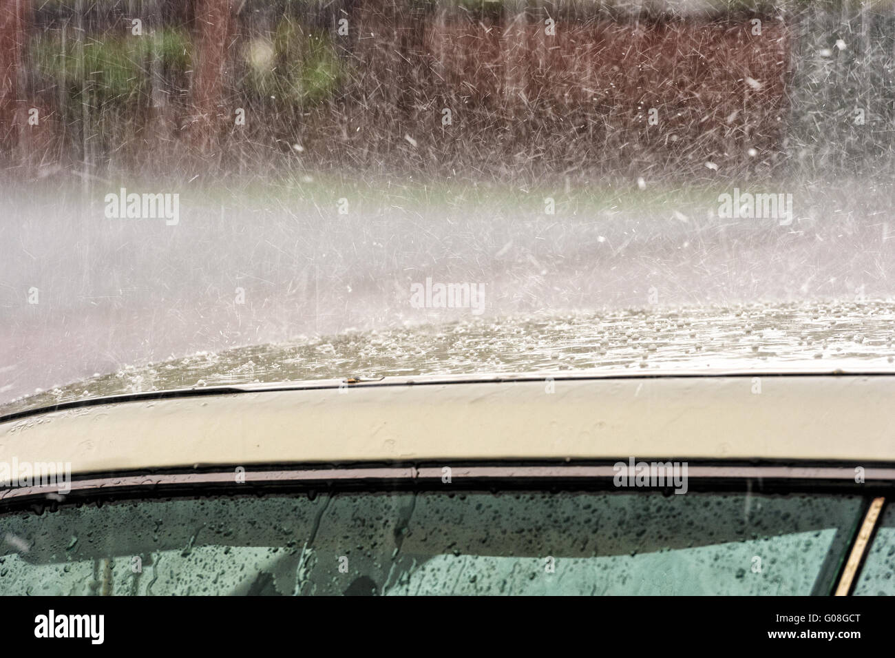 Rain and hail falling on a car roof Stock Photo Alamy