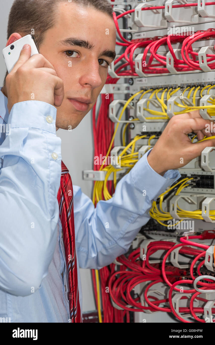 Young man is working at the network Stock Photo