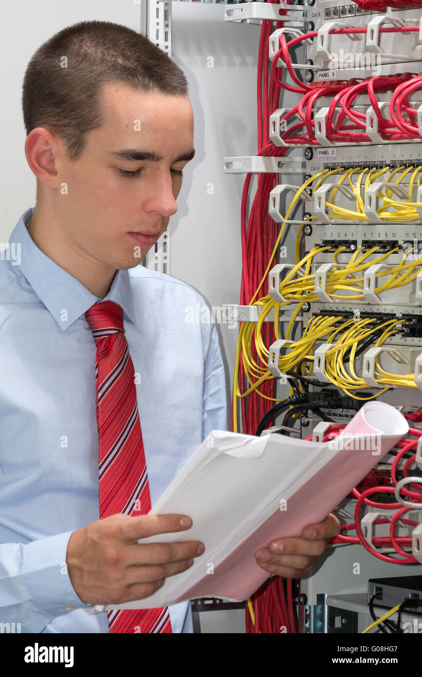Young man is working at the network Stock Photo