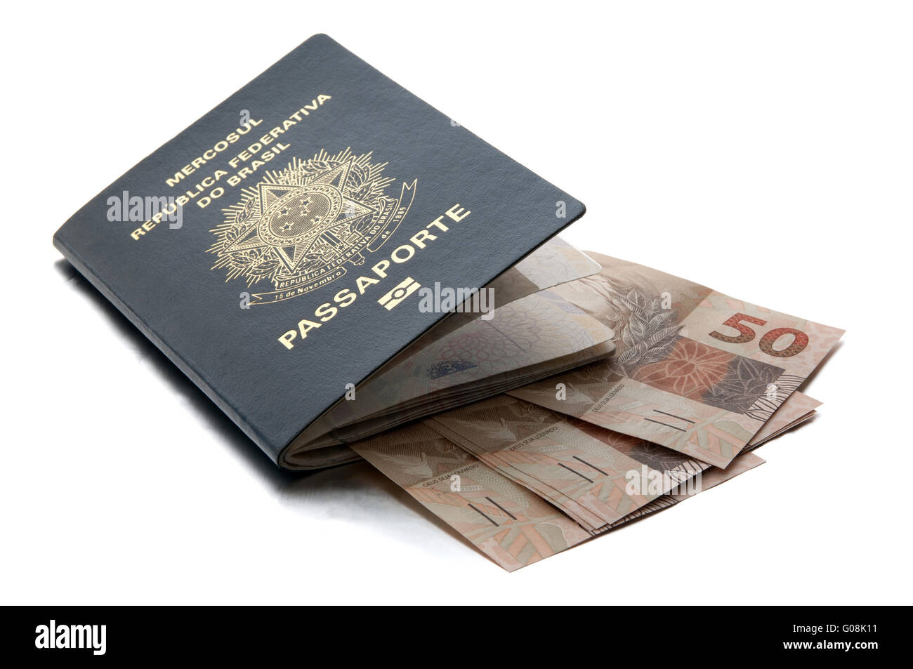 Brazilian passport and brazilian currency (Real) Stock Photo