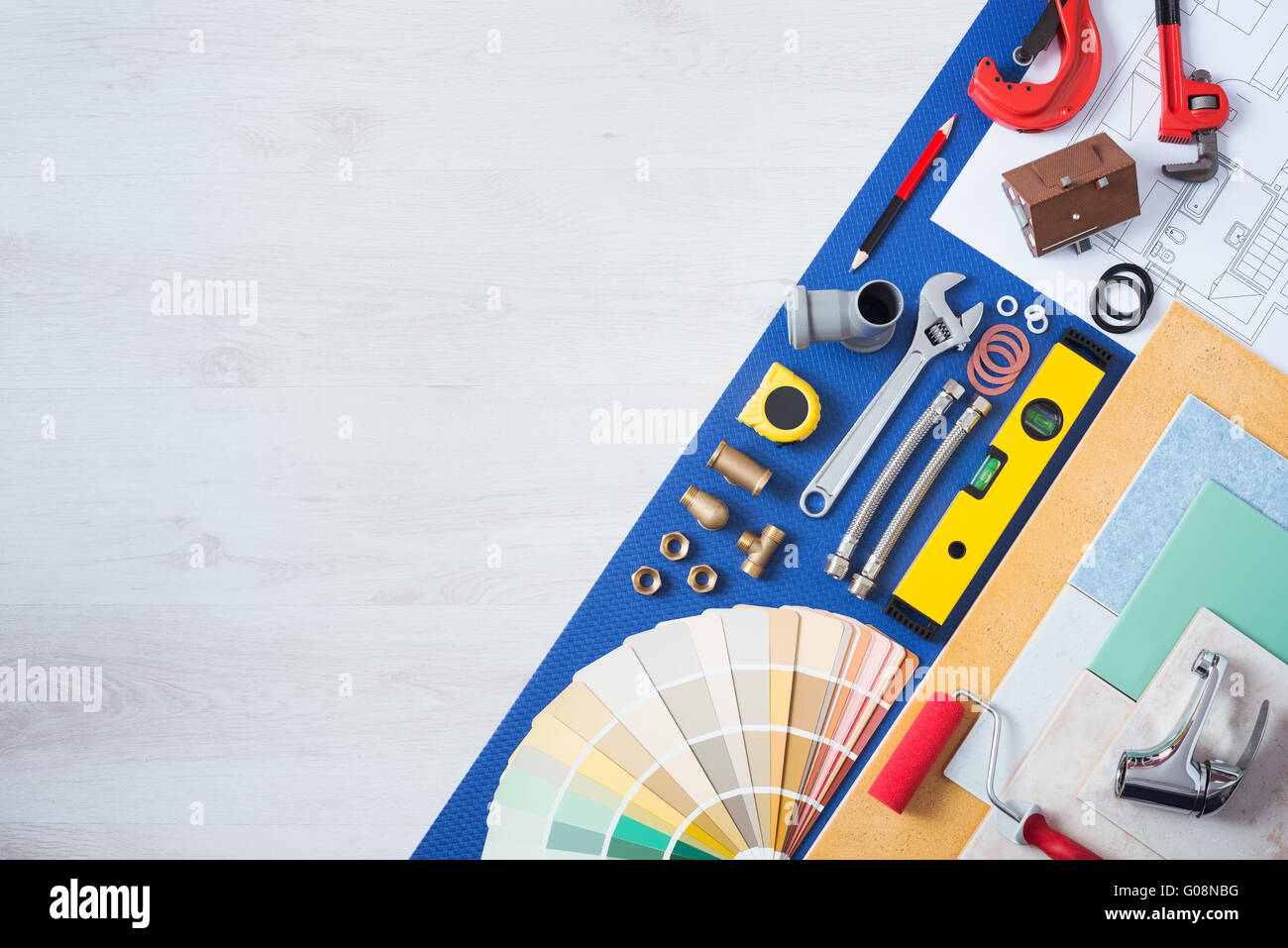 Home improvement and repair concept, plumbing work tools, tap, tiles and color swatches top view Stock Photo