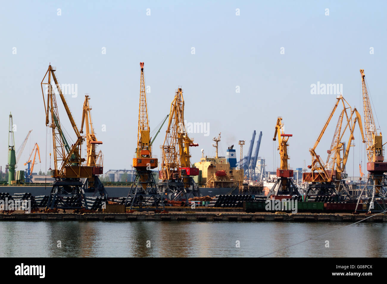 Cargo crane ship and grain dryer in port Odessa Stock Photo