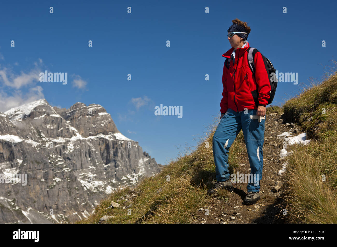 Hiker in the Glarus Alps, Switzerland Stock Photo