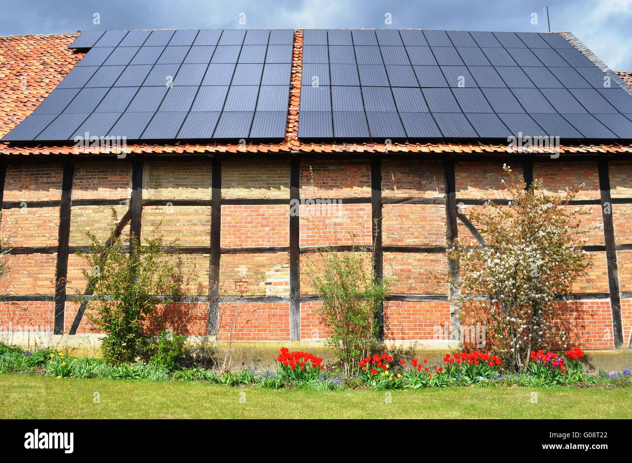 old shed and solar panels on a roof Stock Photo