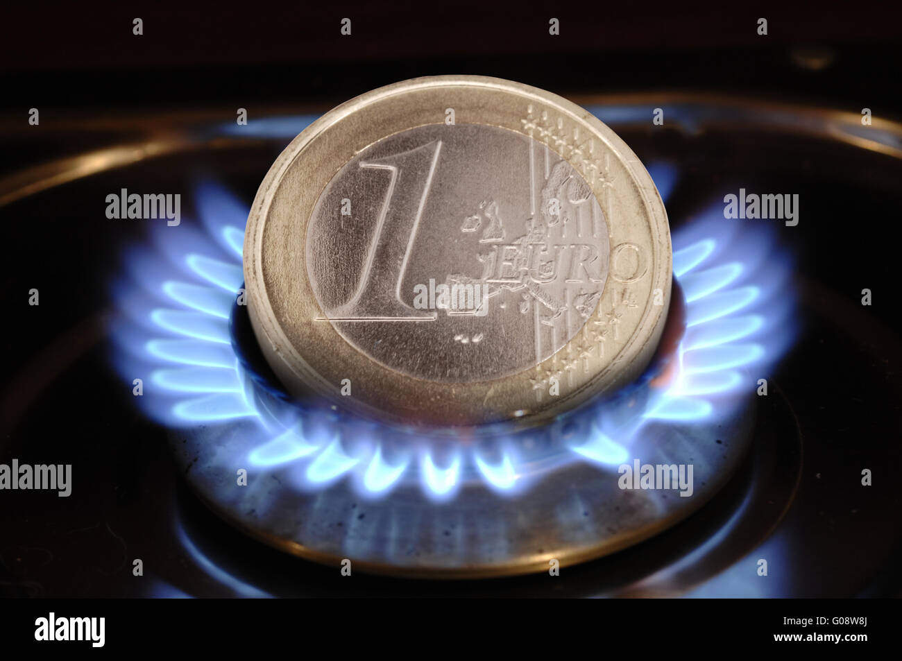 euro burns in flame as symbol for high costs Stock Photo