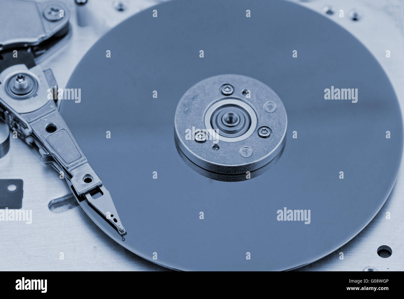 Open computer hard drive on white background with blue (HDD Stock Photo