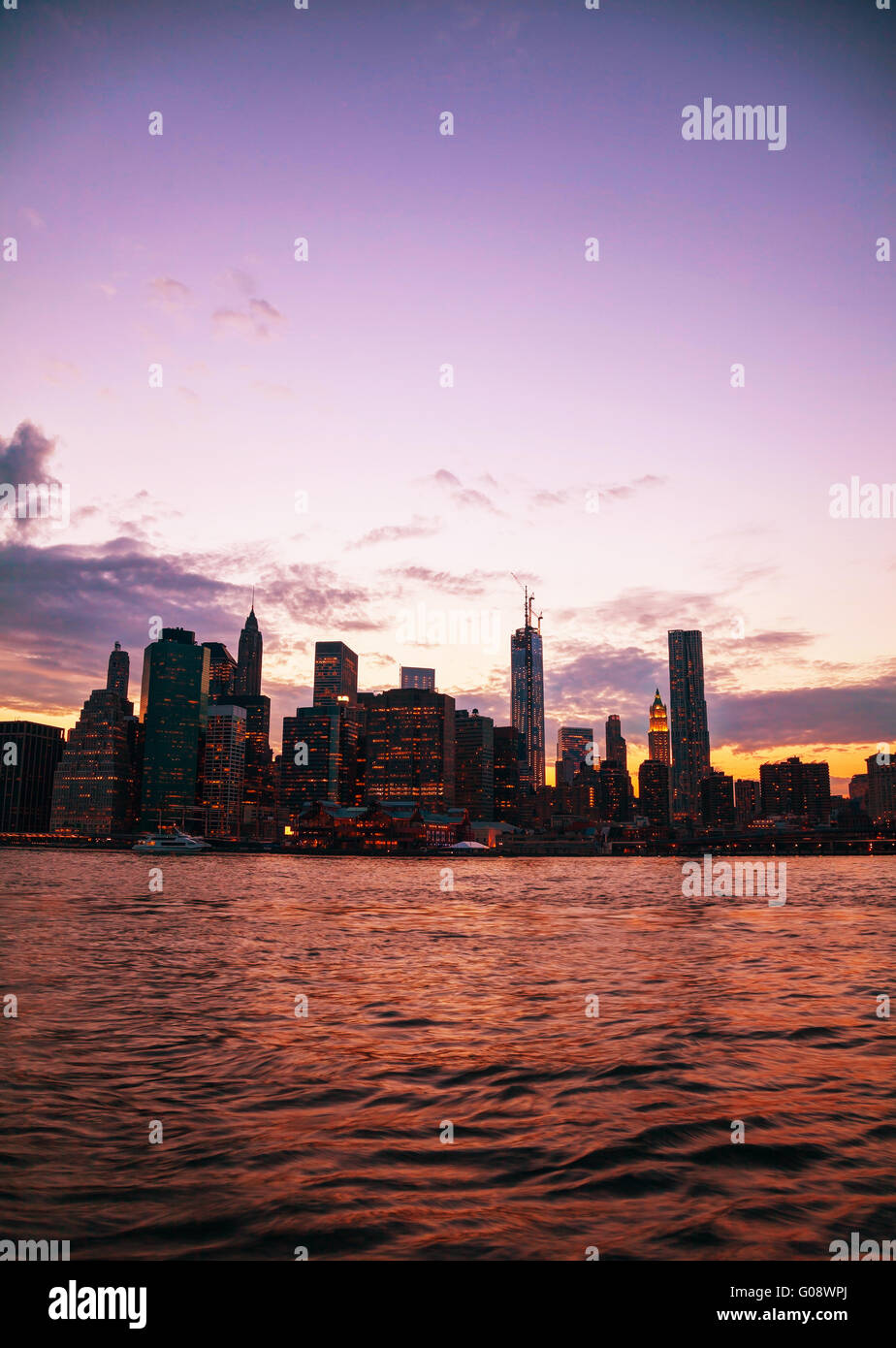 New York City cityscape in the evening at sunset Stock Photo - Alamy