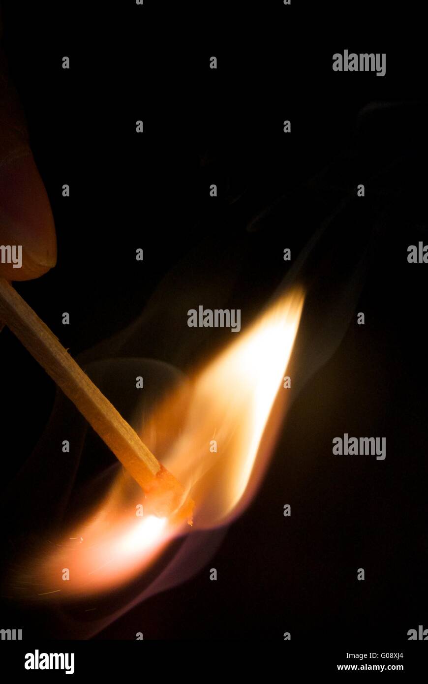burning matchstick Stock Photo