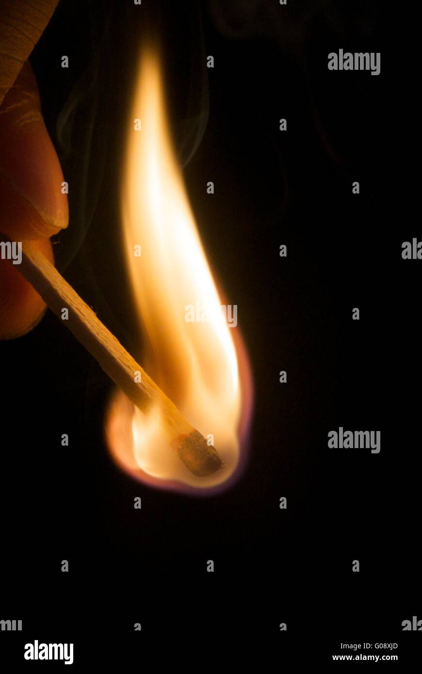 burning matchstick Stock Photo