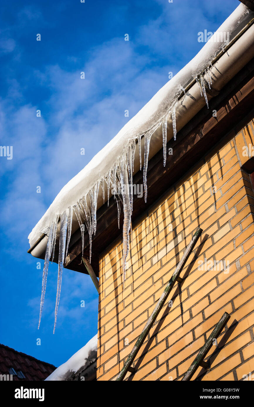 Icicles on roof Stock Photo