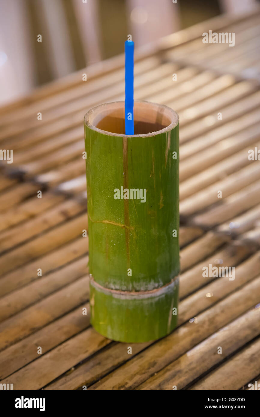 Bamboo wooden cup with traditional drink sold at night market Stock Photo -  Alamy