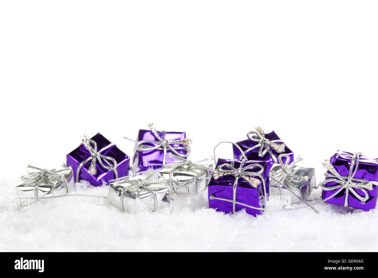 Presents purple and silver on artificial snow Stock Photo