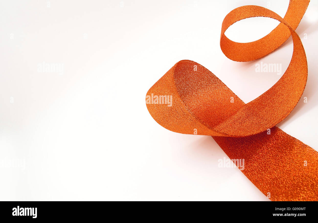 The orange ribbon on a white background Stock Photo - Alamy