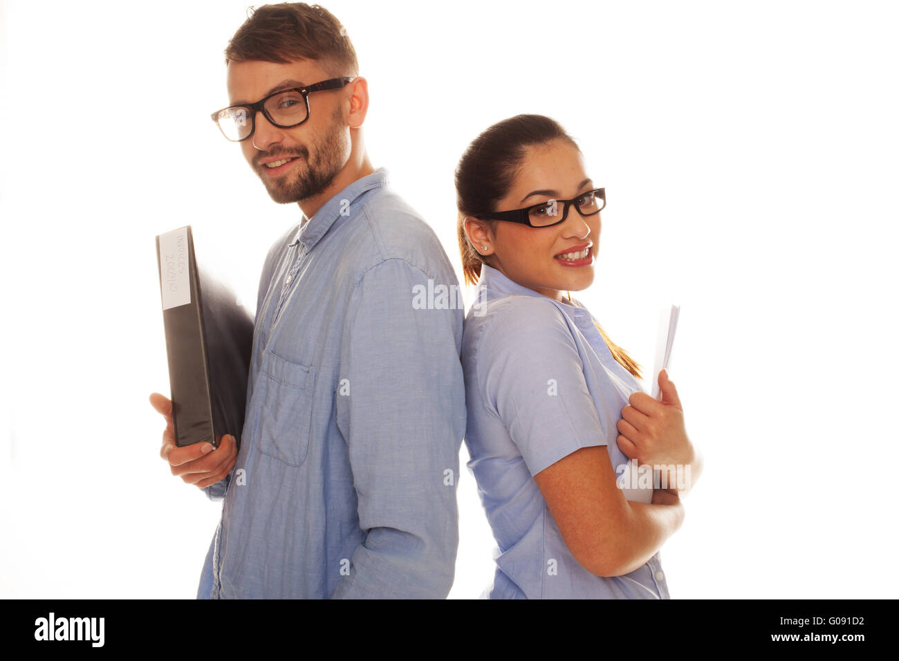 Nerdy couple holding files in a white background Stock Photo