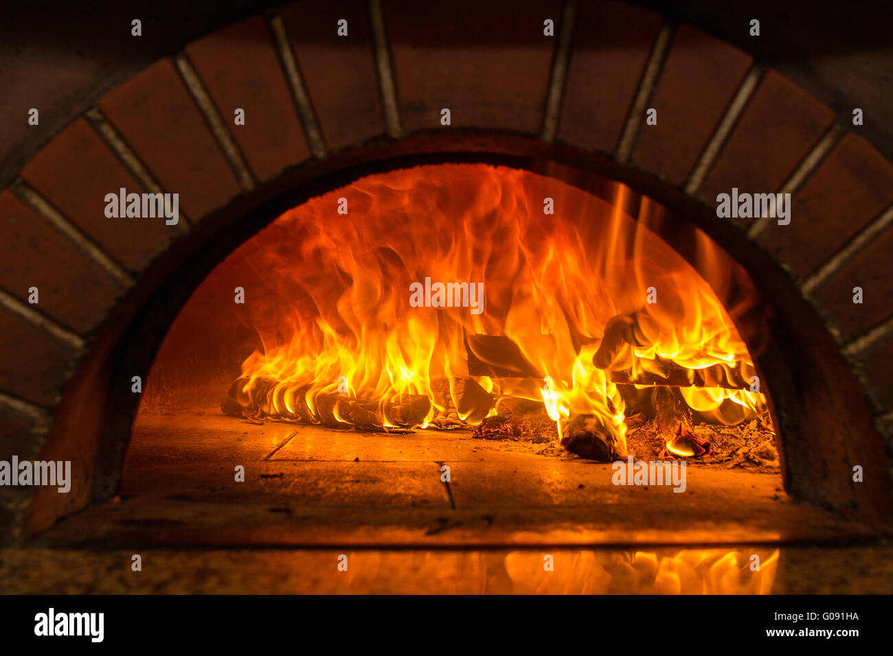 Fire wood burning in the oven Stock Photo