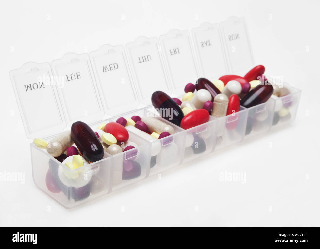 Pill box with variety of pills Stock Photo