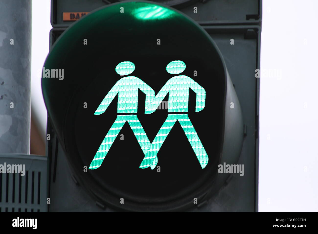 Togetherness - two green traffic light man at the Stock Photo