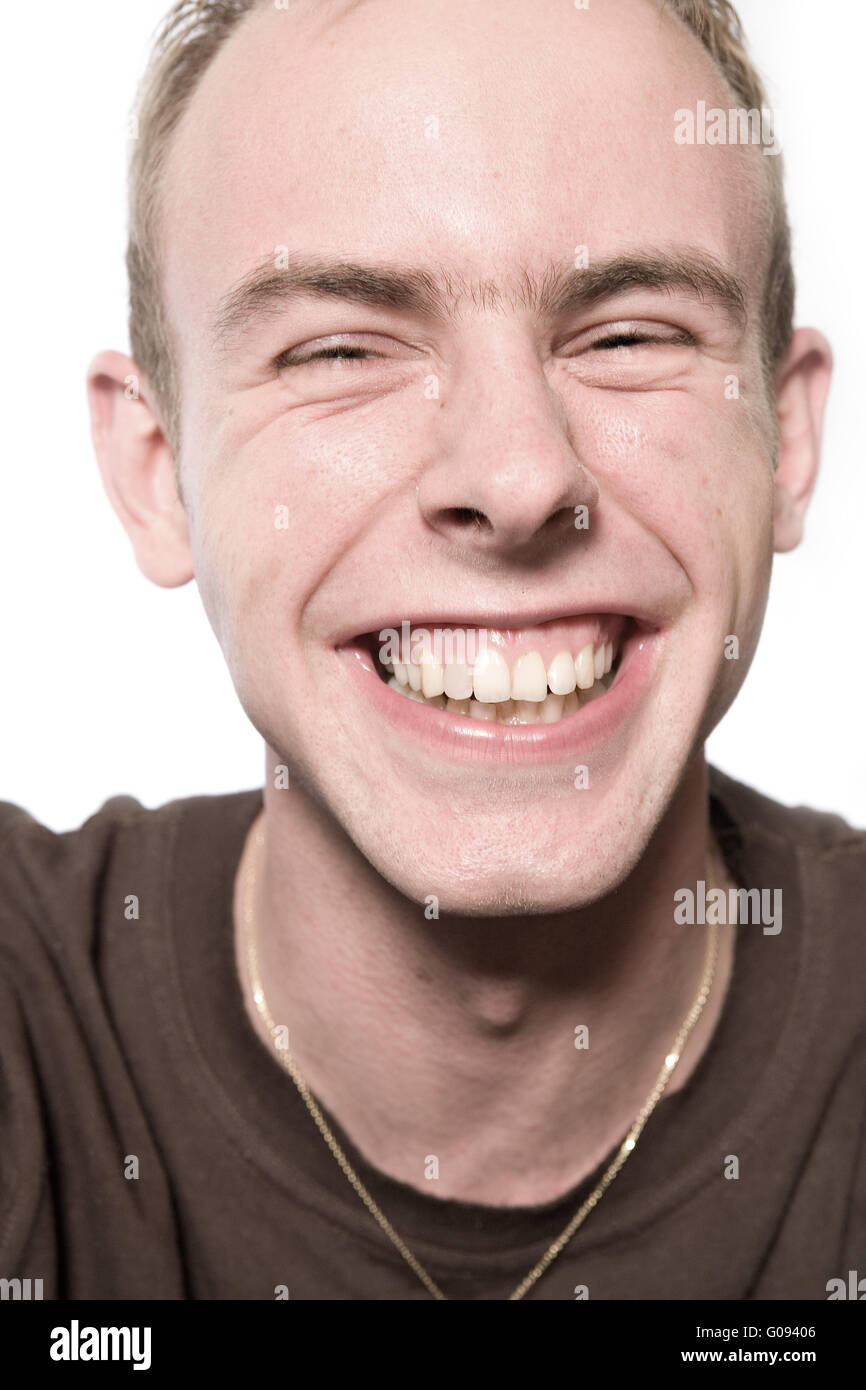 Studio portrait of a young man laughing loud Stock Photo