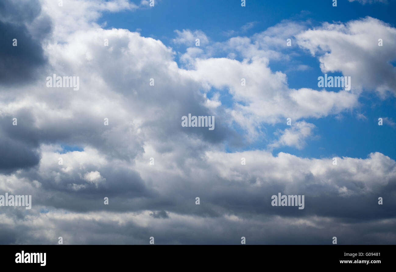 Amazing background of bright blue sky with heavy clouds Stock Photo - Alamy