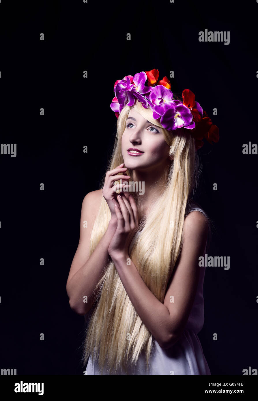 The beautiful girl with a wreath from flowers Stock Photo - Alamy