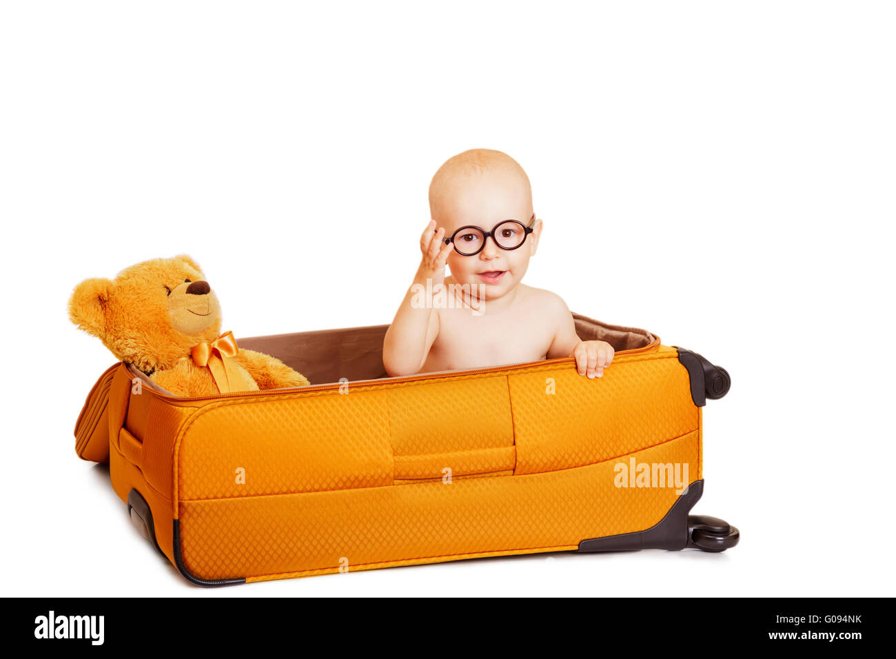 The little boy сидиит in a suitcase it's isolated on white Stock Photo