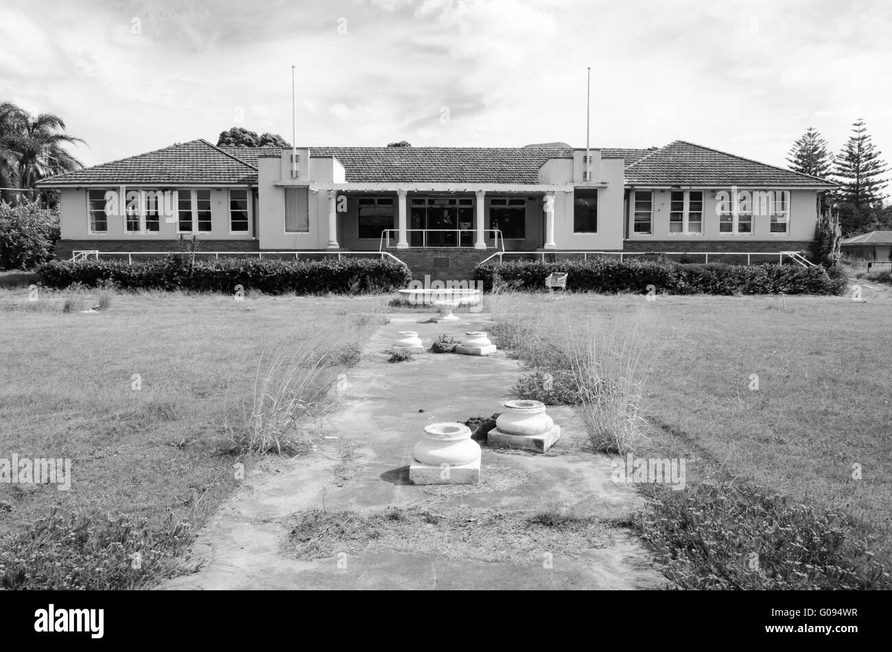 The front entrance leading to the abandoned former Taree City Bowling Club, in regional Australia Stock Photo
