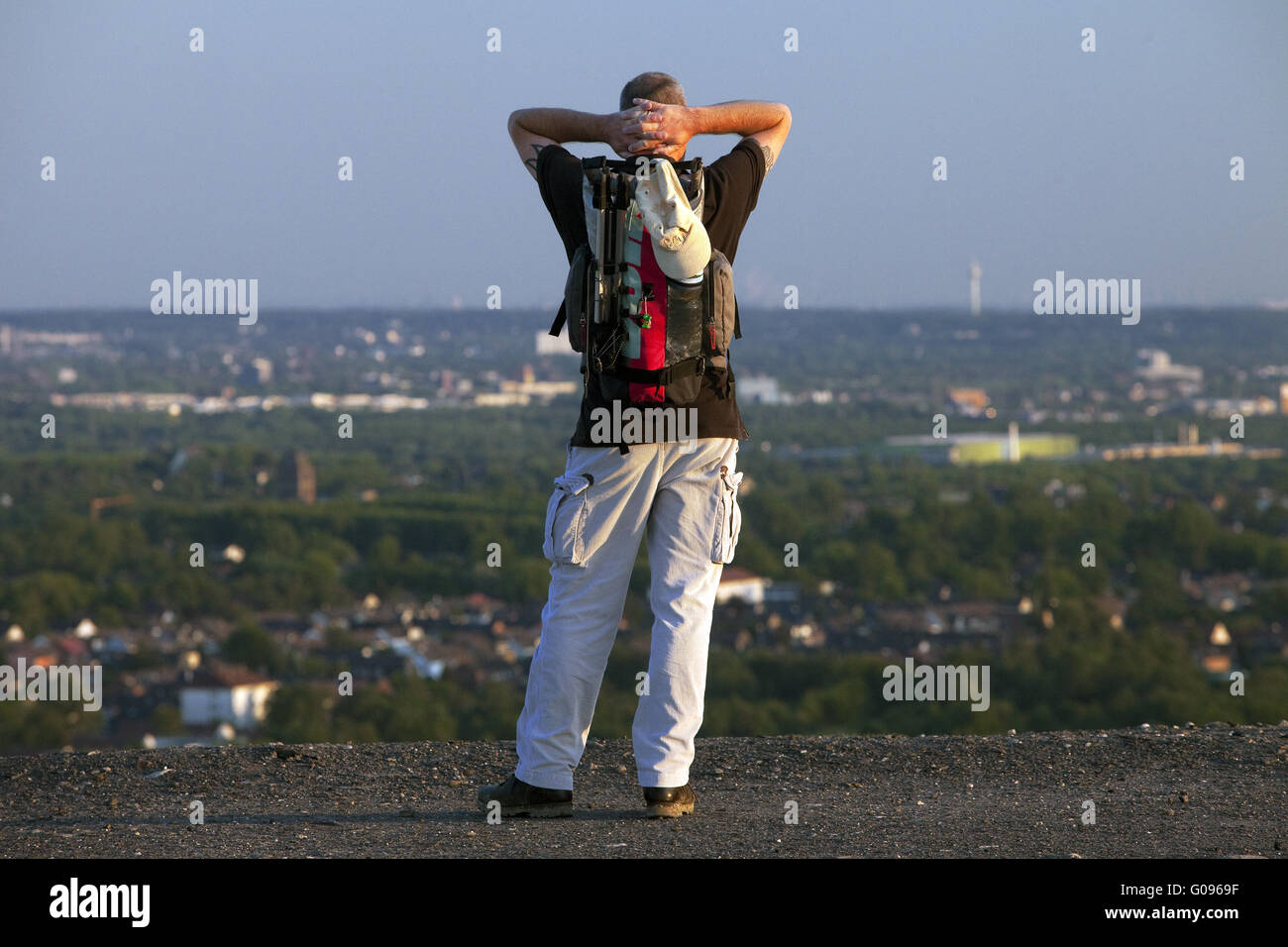 Man looks out of the heap Haniel in Bottrop. Stock Photo