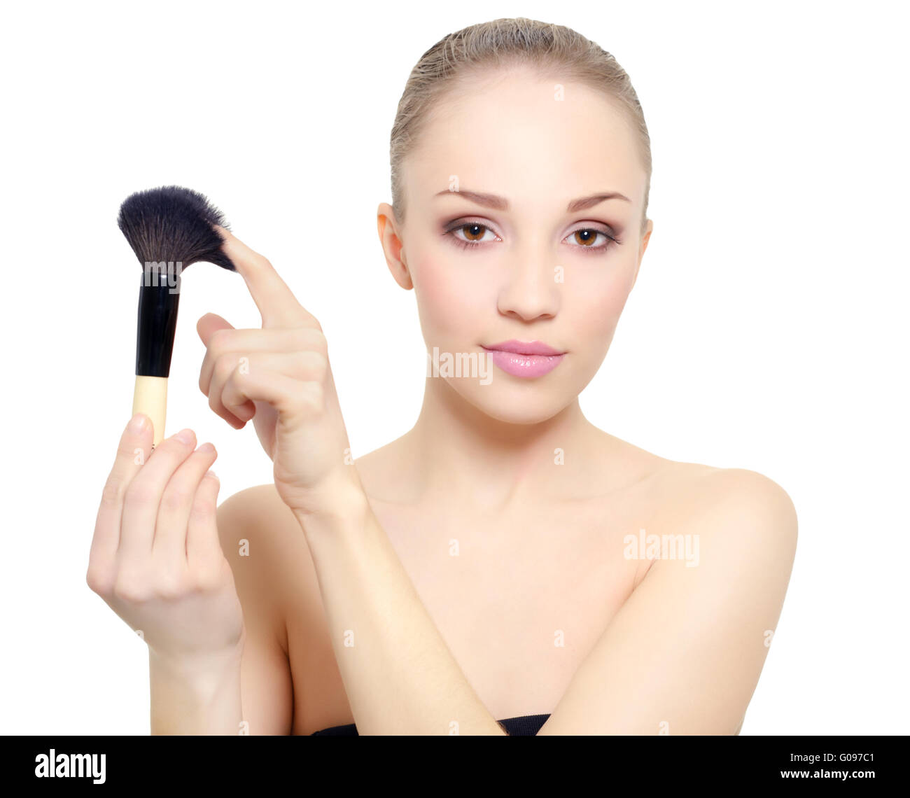Portrait of girl with make-up brush isolated on white Stock Photo