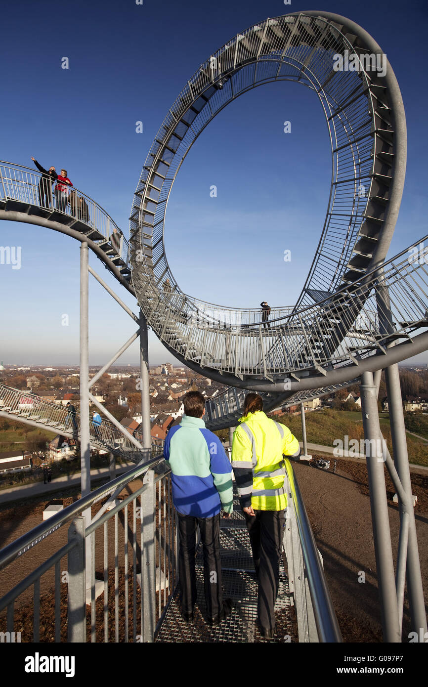 Persons on the landmark Tiger and Turtle, Duisburg Stock Photo