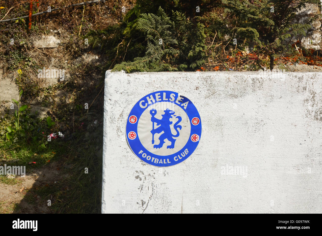 Chelsea Football Club logo sticker stuck on a wall somewhere in Darjeeling. Stock Photo