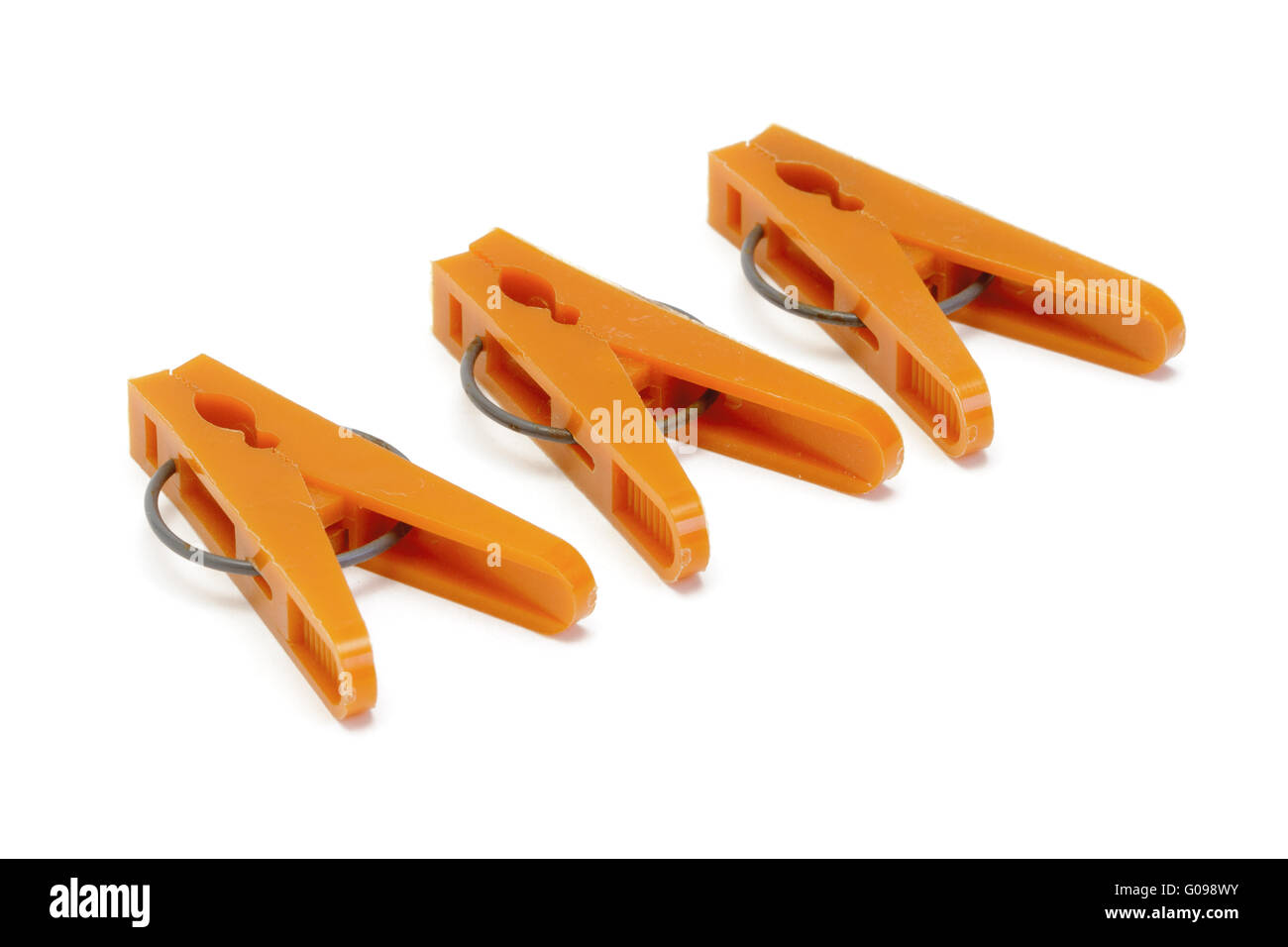 Orange plastic clothespins Stock Photo