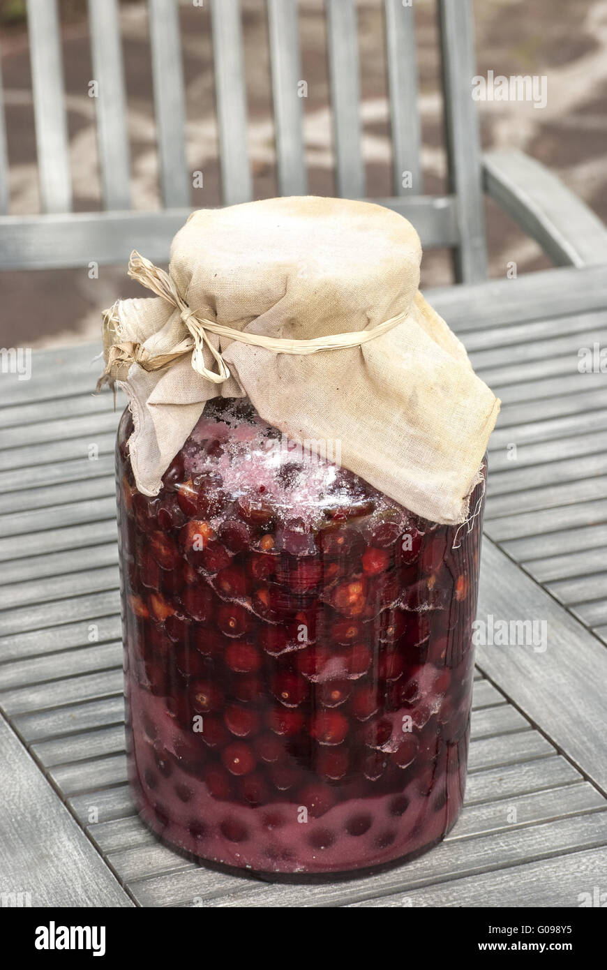 Large glass jar with sugar soaked sour cherries fo Stock Photo Alamy