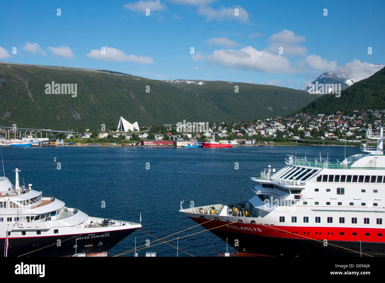 Norway, Tromso. Cruise ship and port area. Hurtigruten sightseeing ship, Polarlys, and Silverseas expedition ship. Stock Photo