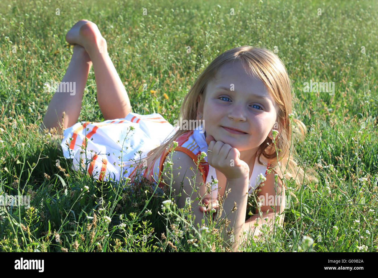 portrait of little fashionable girl on the nature Stock Photo - Alamy