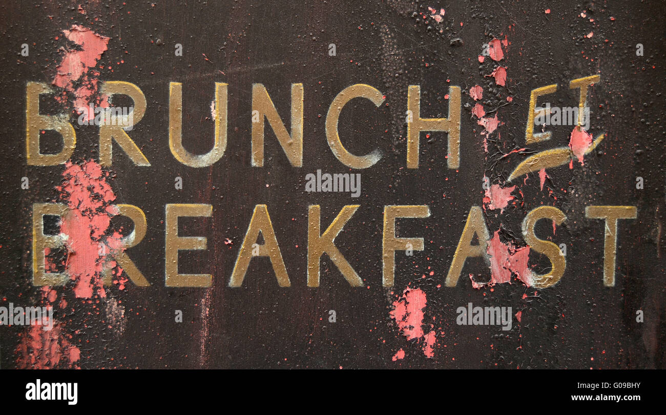 A Grungy French Brunch And Breakfast Sign Outside A Restaurant Stock Photo
