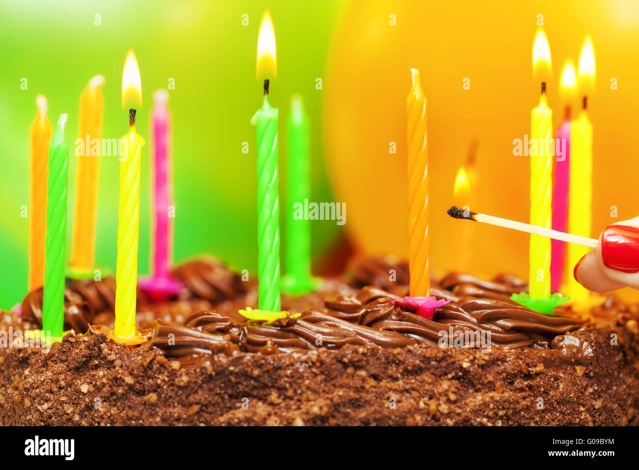 Matches near the candles on the birthday cake Stock Photo Alamy