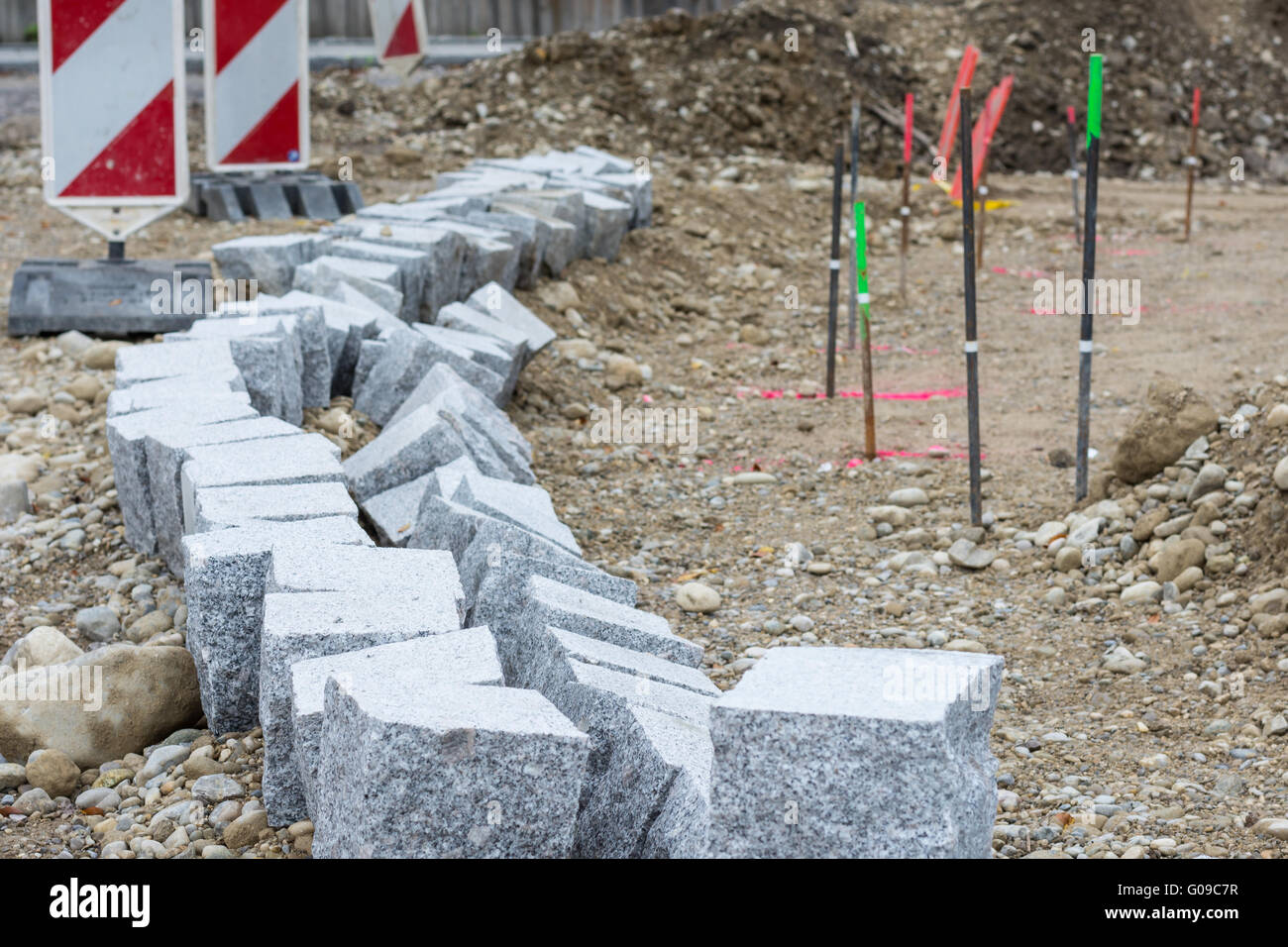 Road works – building curbstones Stock Photo