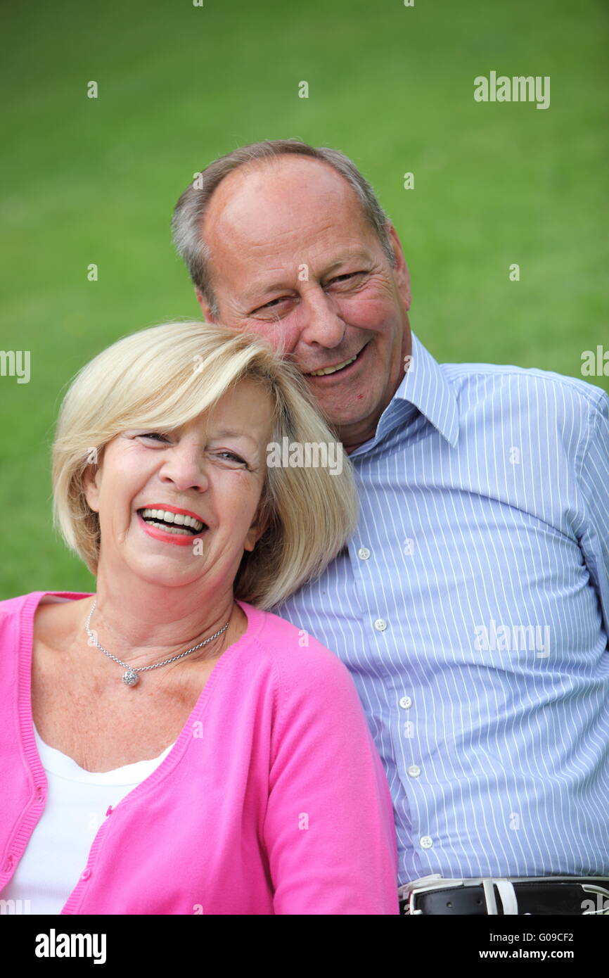 Senior Caucasian couple laughing together outdoors Stock Photo