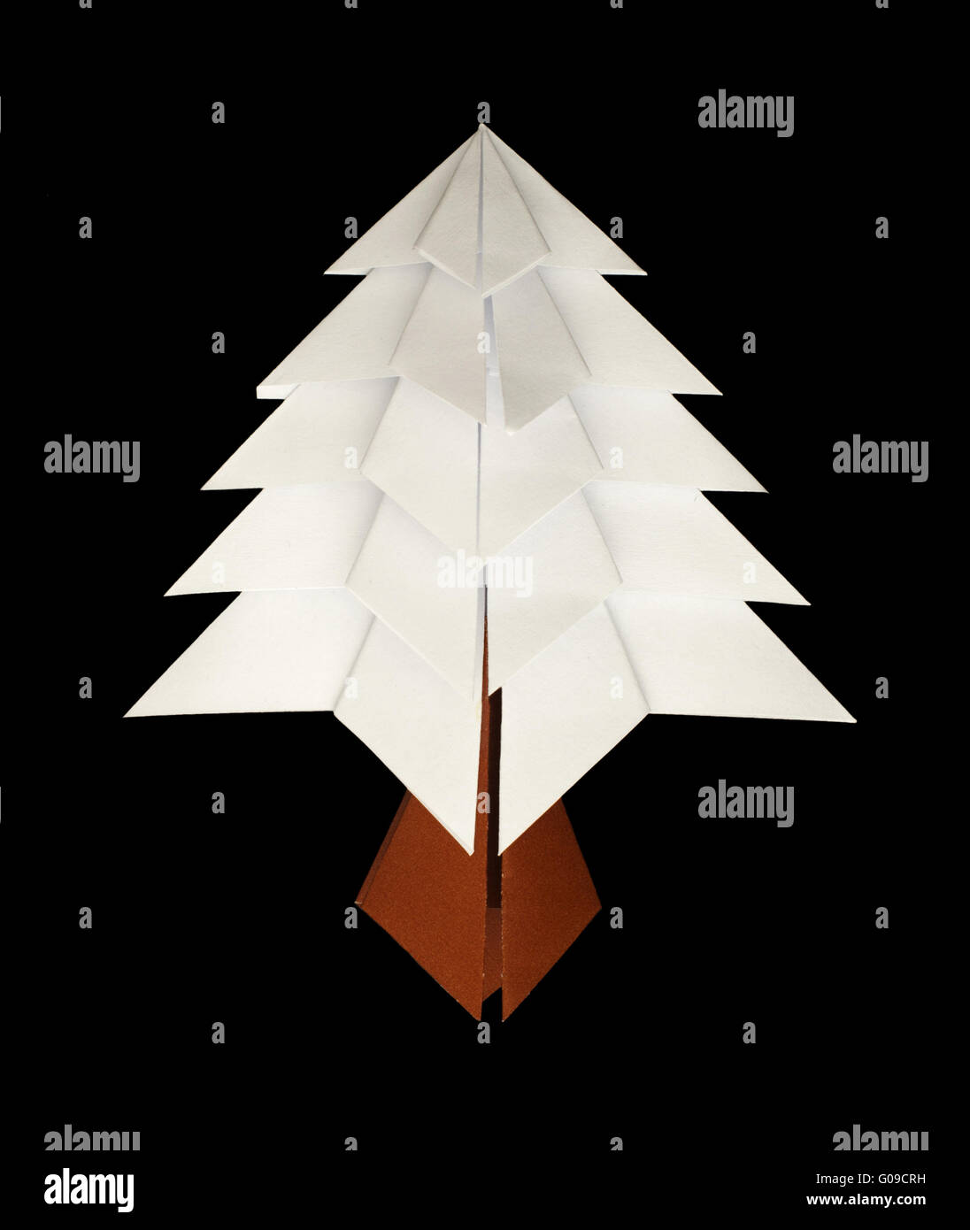 White christmas tree made of paper. Origami evergreen tree Stock Photo ...