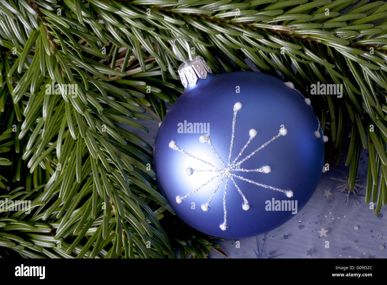 blue christmas ball with pattern and pine branch Stock Photo