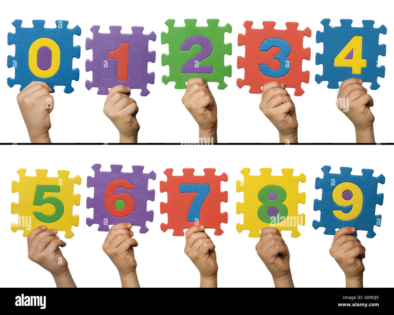 Children hands holding numbers. White isolated multicolor numbers Stock Photo