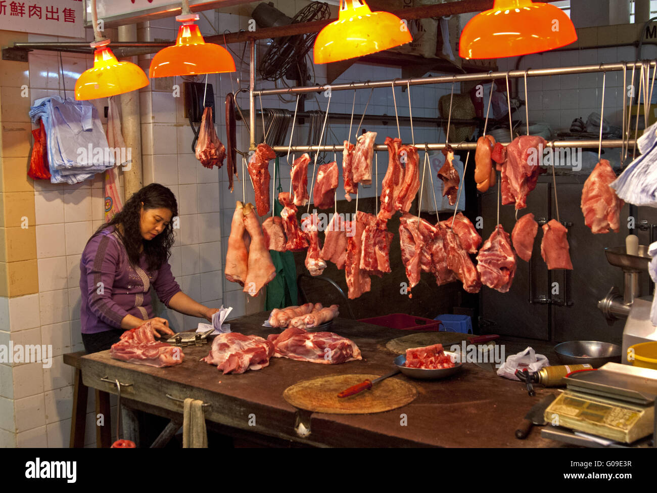 At the butcher's on the meat market, Hong Kong Stock Photo