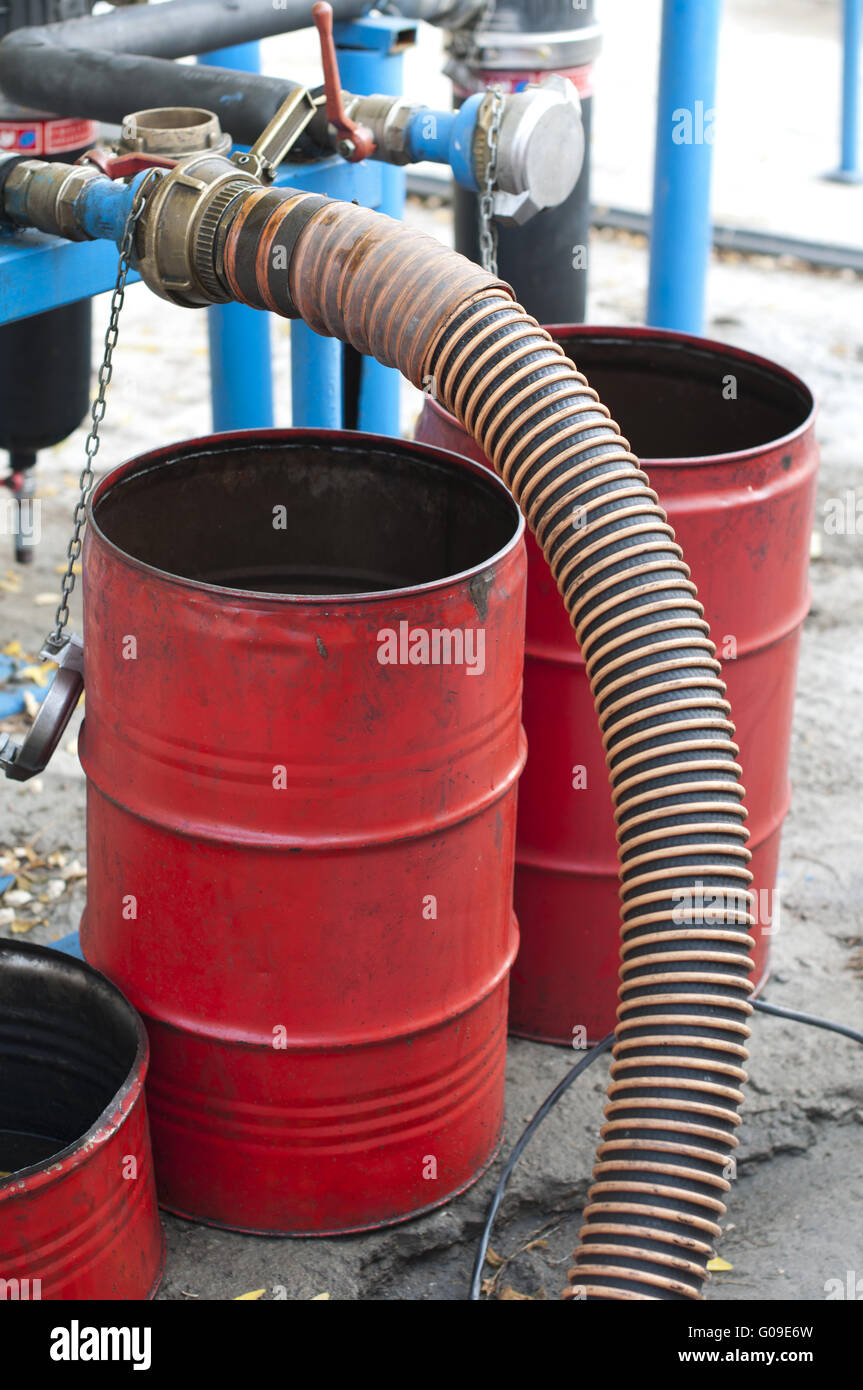 Truck Hoses for fuel station, pumps and oil barrels Stock Photo Alamy