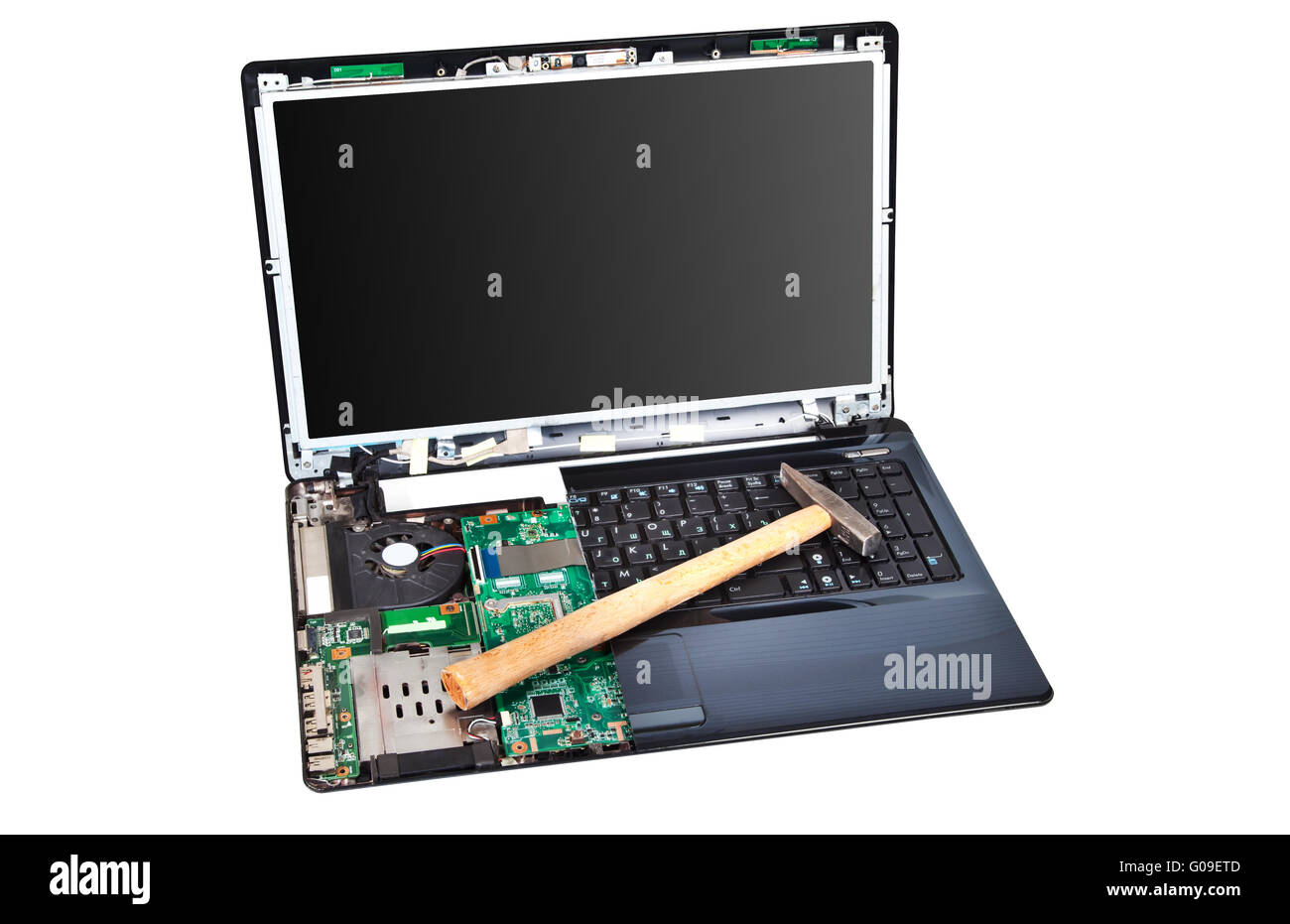 Laptop half disassembled with hummer on it Stock Photo