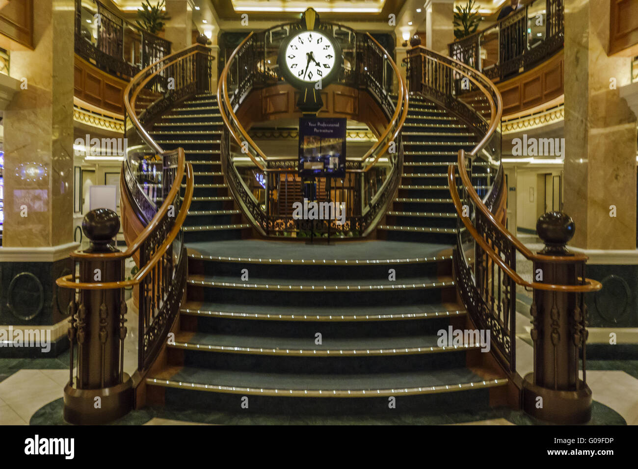 Ship Queen Elizabeth Midships Stairs and Clock Stock Photo